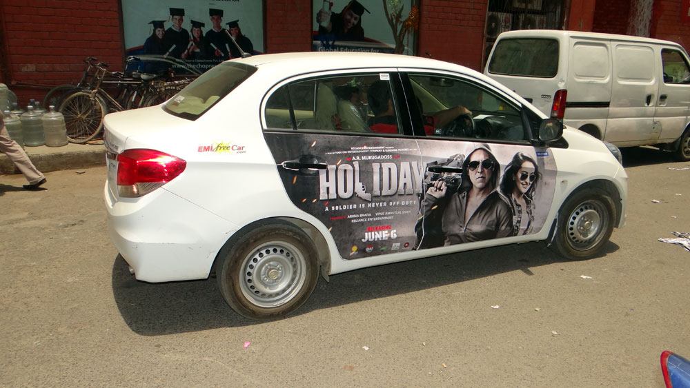 Akshay Kumar's Holiday emifreecar.com, holiday movie car advertisement in New Delhi