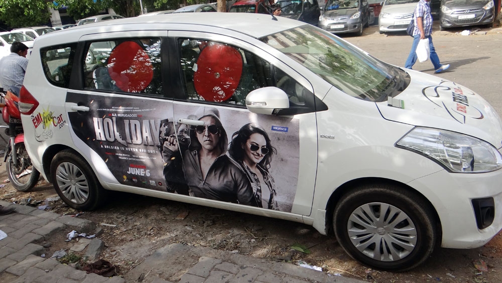 Akshay Kumar's Holiday emifreecar.com, holiday movie car advertisement in New Delhi