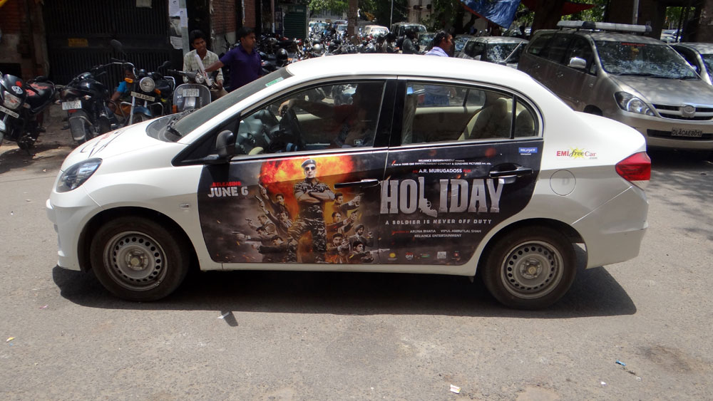 Akshay Kumar's Holiday emifreecar.com, holiday movie car advertisement in New Delhi