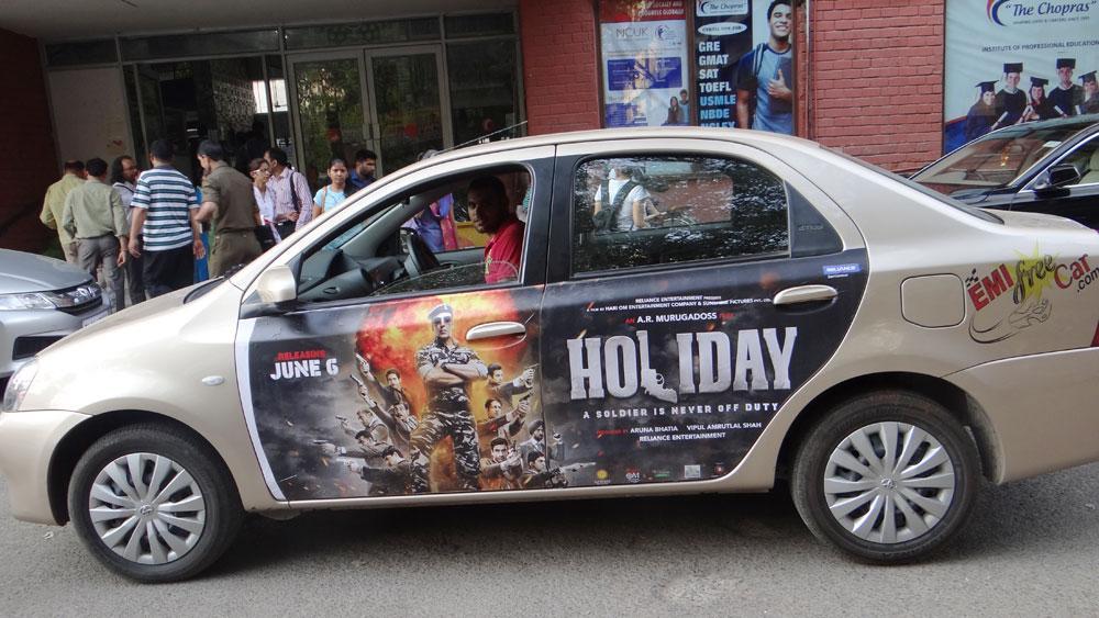 Akshay Kumar's Holiday emifreecar.com, holiday movie car advertisement in New Delhi