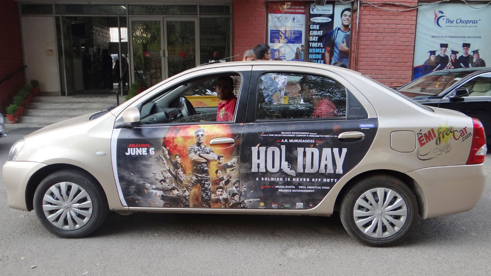 Akshay Kumar's Holiday emifreecar.com, holiday movie car advertisement in New Delhi